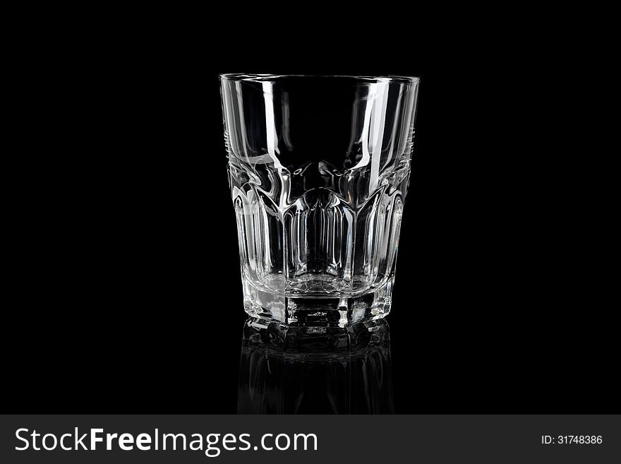 Empty glass on black background, crystal clear