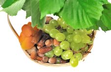 Basket Of Dried Fruits And Grapes Stock Photo