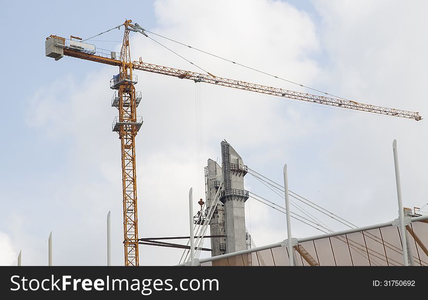 Construction site with crane and heavy machine