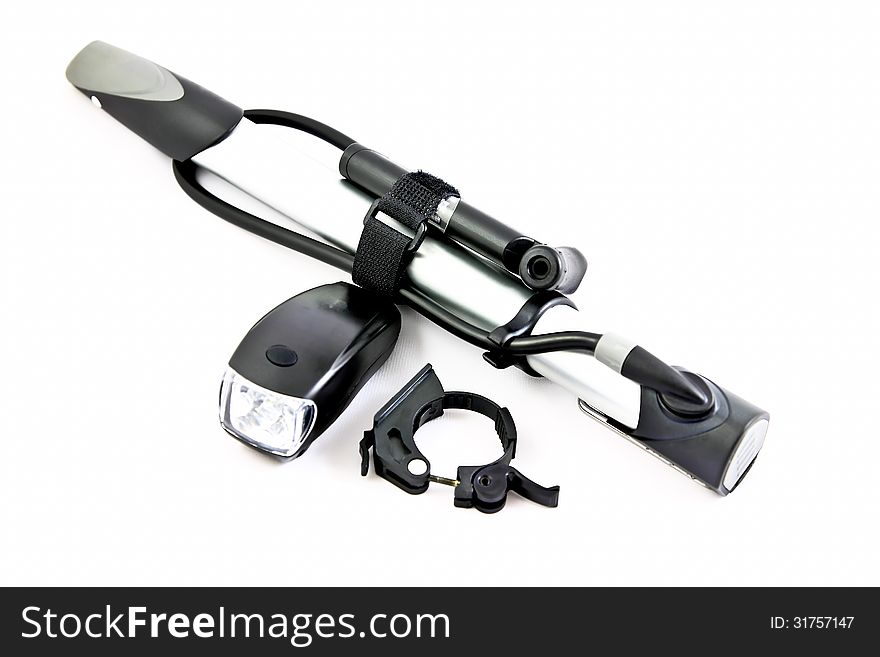 Bicycle pumps with small headlamp on a white background. Bicycle pumps with small headlamp on a white background