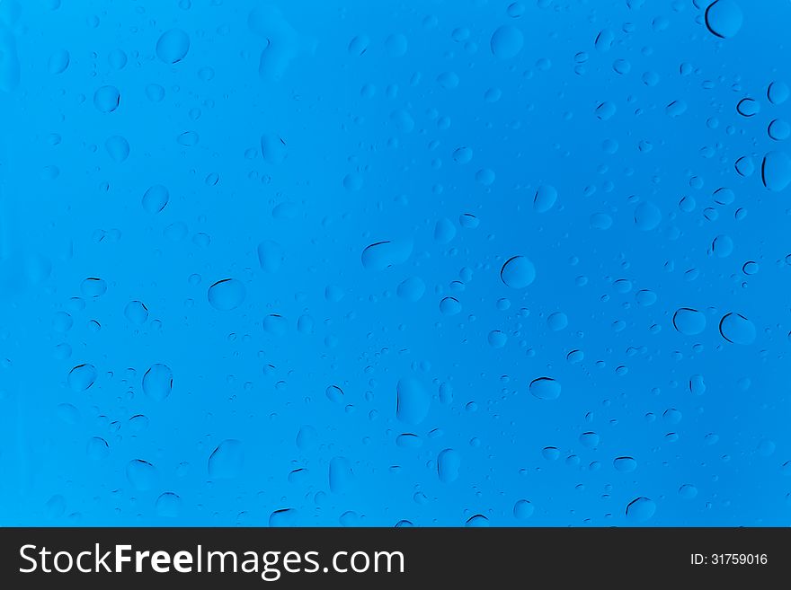 Rain water drop on blue tint color glass. Rain water drop on blue tint color glass