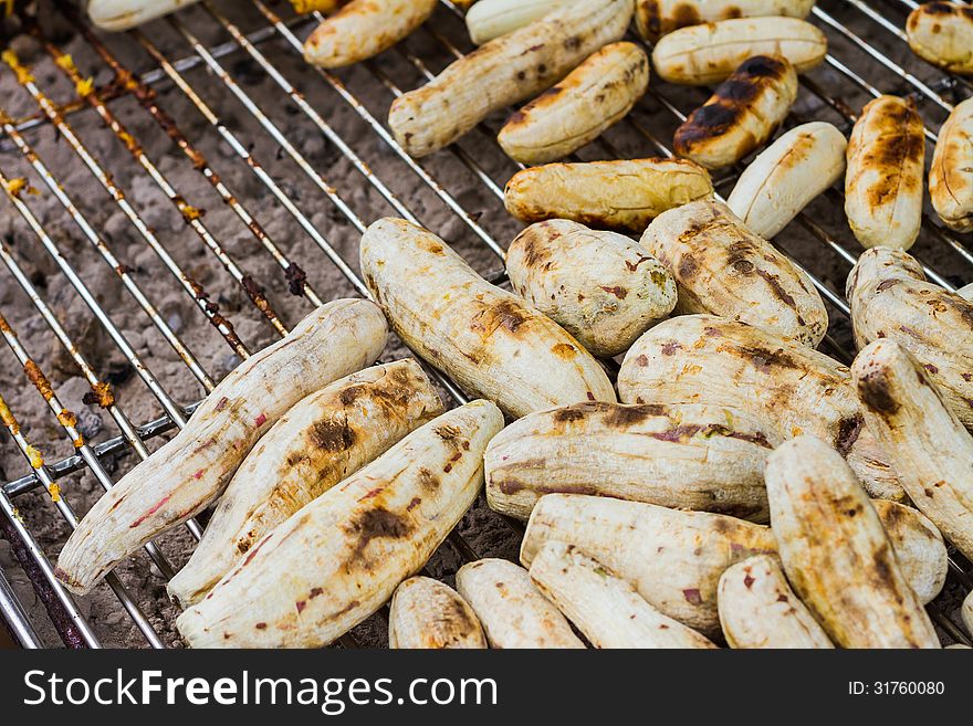 Grilled cassava on the steel grill