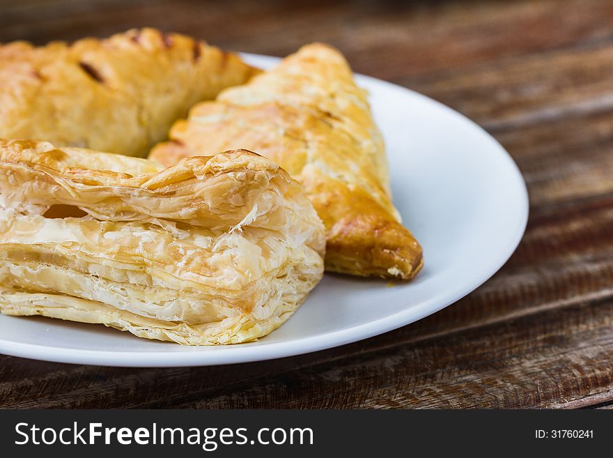 Close up of assorted flavour pie on wooden table