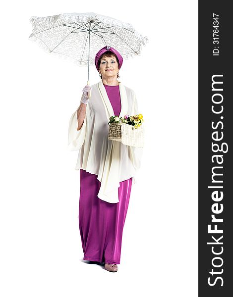 Beautiful woman with basket of flowers holding umbrella. Beautiful woman with basket of flowers holding umbrella