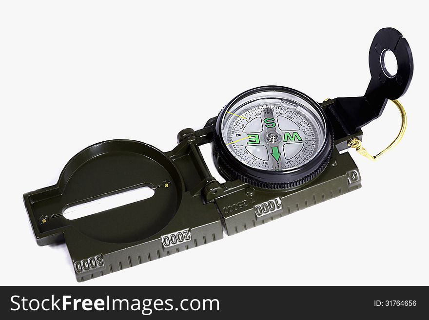 A Small Compass In A Metal Frame On A White Background.