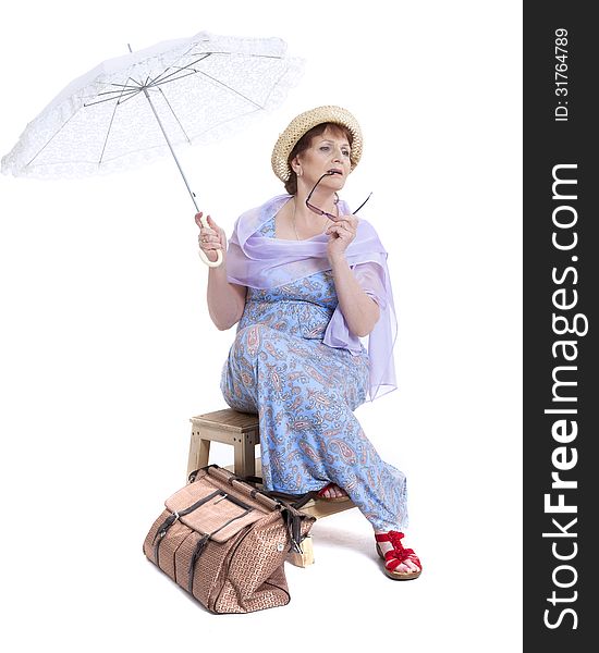 Beautiful woman with basket of flowers holding umbrella. Beautiful woman with basket of flowers holding umbrella