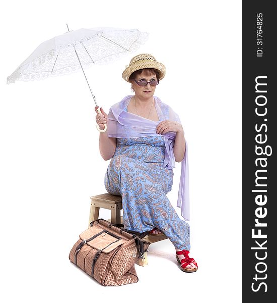 Beautiful woman with basket of flowers holding umbrella. Beautiful woman with basket of flowers holding umbrella