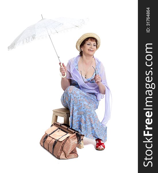 Beautiful woman with basket of flowers holding umbrella. Beautiful woman with basket of flowers holding umbrella