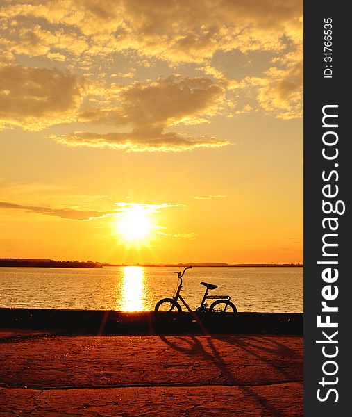 Bicycle By The Lake At Sunset