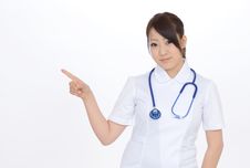 Young Asian Female Nurse Showing Blank Sign Stock Image