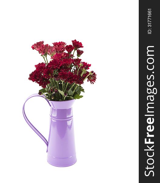 Red flowers and a purple flagon on a white background.