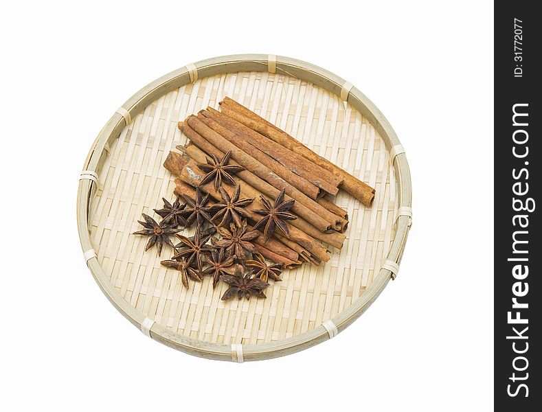 Herbs and spices on woven bamboo basket.