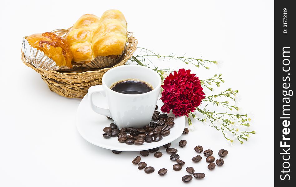A cup of coffee and bakeries in basket on white background.