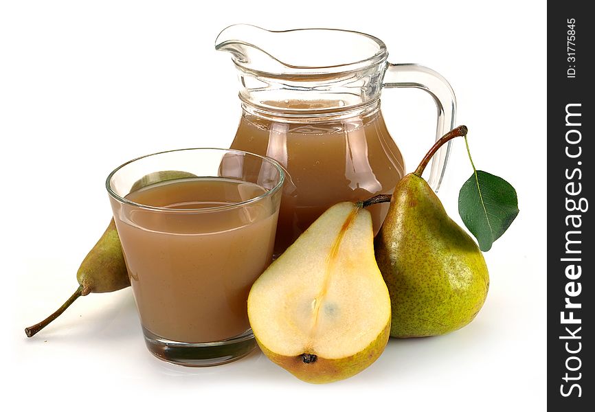 Pear juice in a jug and a glass of fruit. Pear juice in a jug and a glass of fruit