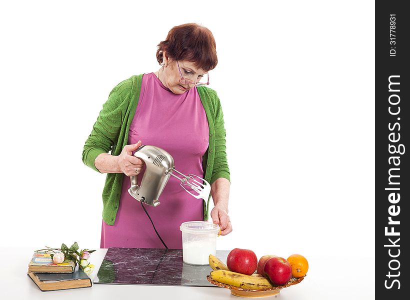 Woman cooking with mixer.