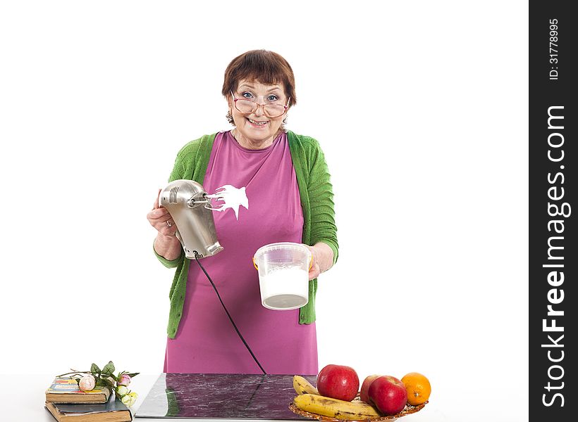 Woman cooking with mixer.
