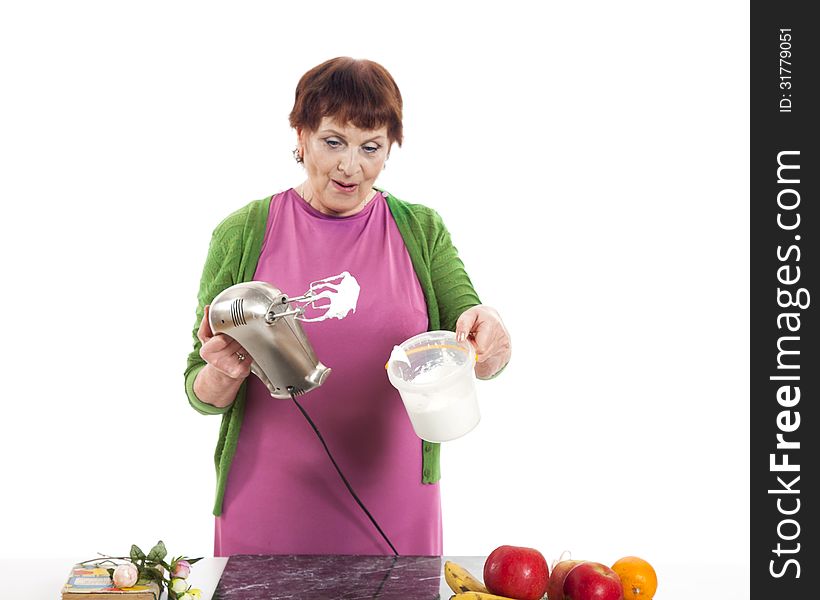 Woman cooking with mixer.