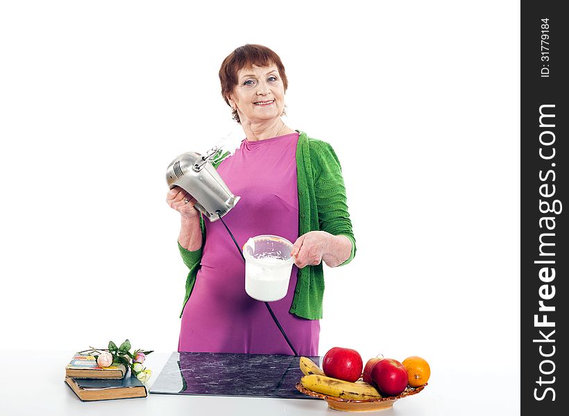 Woman cooking with mixer.