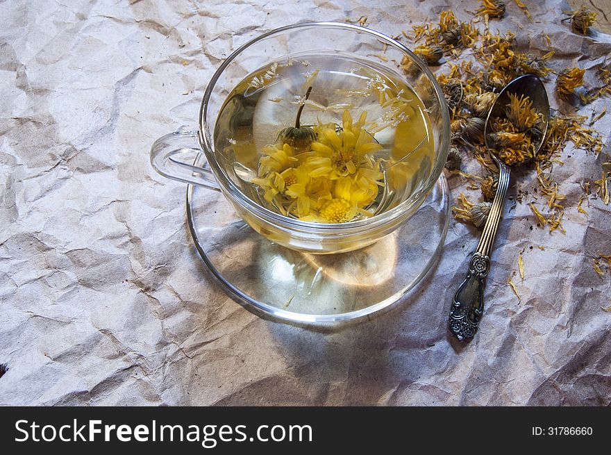 A Cup Of Herbal Tea On The Packaging Paper