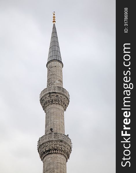 Minaret of a mosque in Istanbul, view from below. Minaret of a mosque in Istanbul, view from below