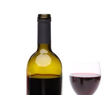 A Bottle Of Red Wine With A Wine Glass. Royalty Free Stock Photos