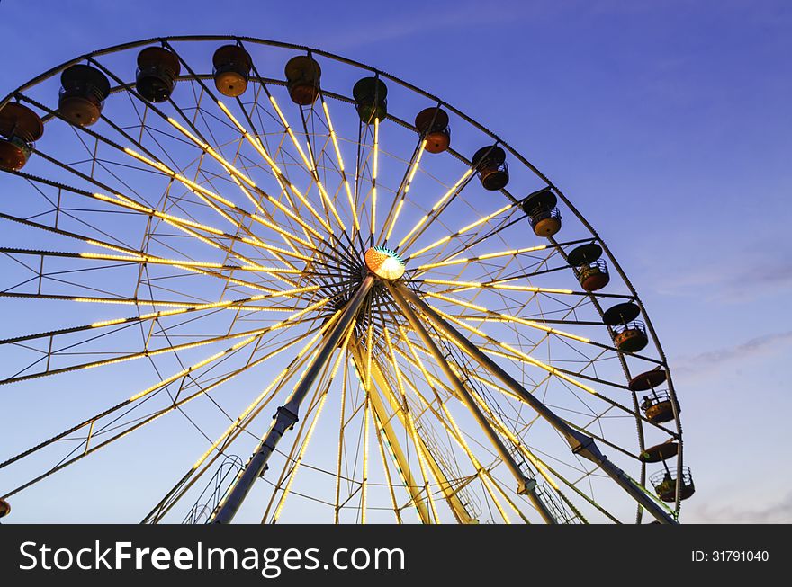 The big ferris wheel with blue sky