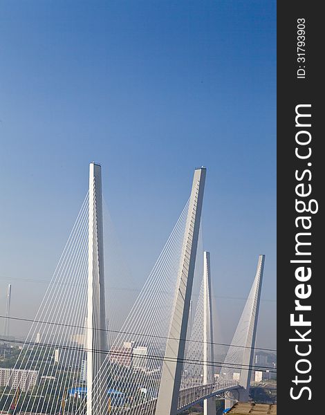 Suspension bridge in the light of the morning sun