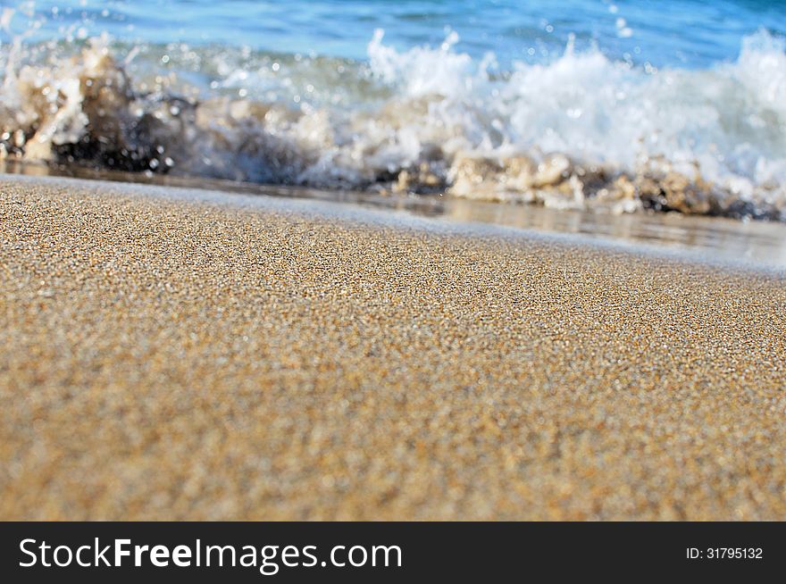 Wave splashing on a beautiful sandy beach in Hersonissos,Crete, Greece !