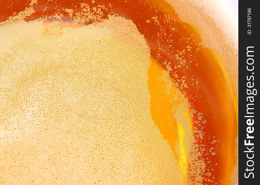 Glass of beer, top view close-up the whole background. Glass of beer, top view close-up the whole background.