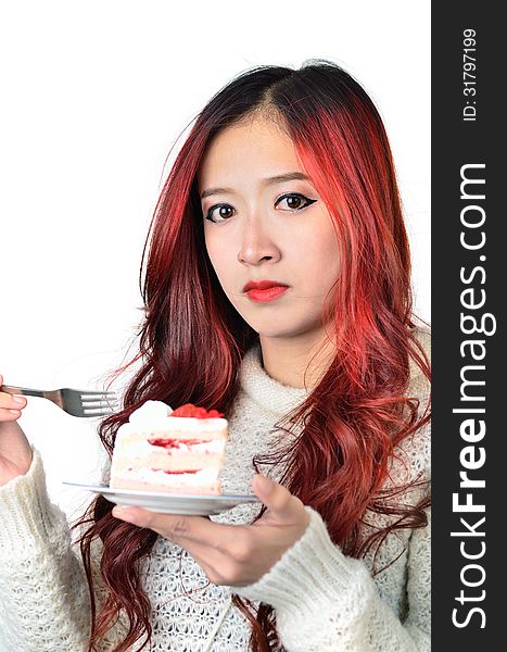 Close up beautiful asian woman with red long hair eating cake. Close up beautiful asian woman with red long hair eating cake