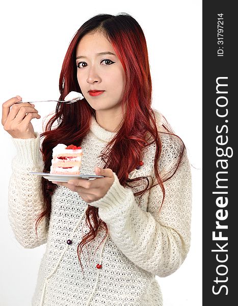 Close up beautiful asian woman with red long hair eating cake. Close up beautiful asian woman with red long hair eating cake