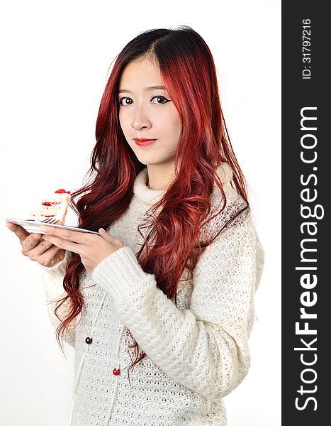 Close up beautiful asian woman with red long hair eating cake. Close up beautiful asian woman with red long hair eating cake