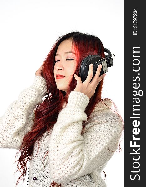 Asian woman with red color long hair listening. Asian woman with red color long hair listening