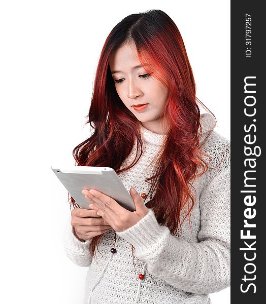 Asian woman with red color long hair using tablet. Asian woman with red color long hair using tablet