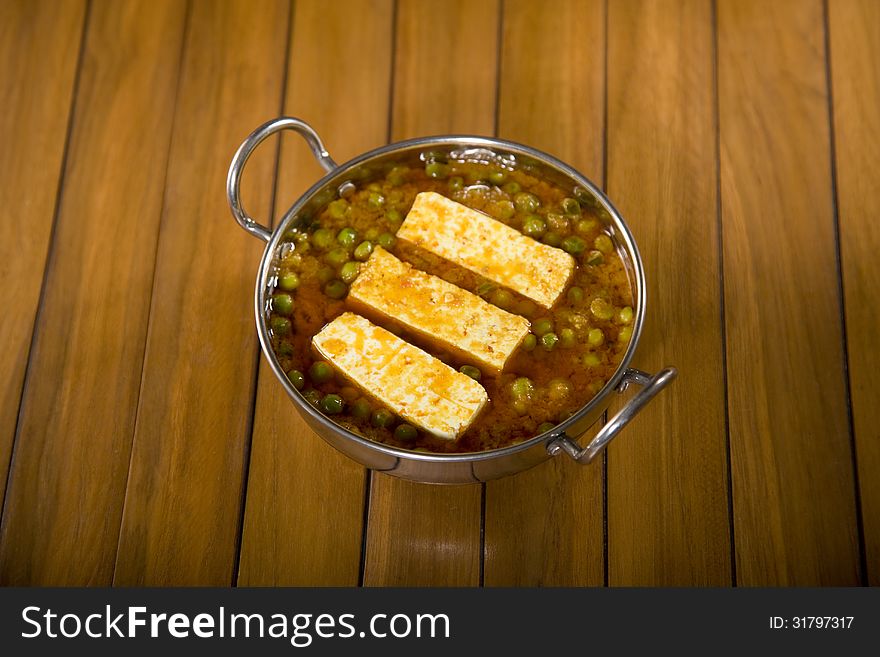 Indian Cheese Cooked with Peas. Indian Cheese Cooked with Peas