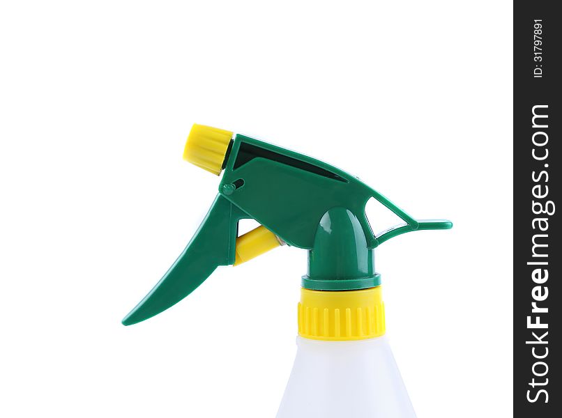 Spray from a bottle of cleaner on the white background
