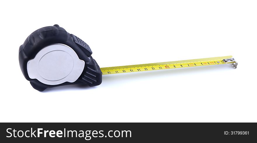 Tape measure isolatedis located left on the white background