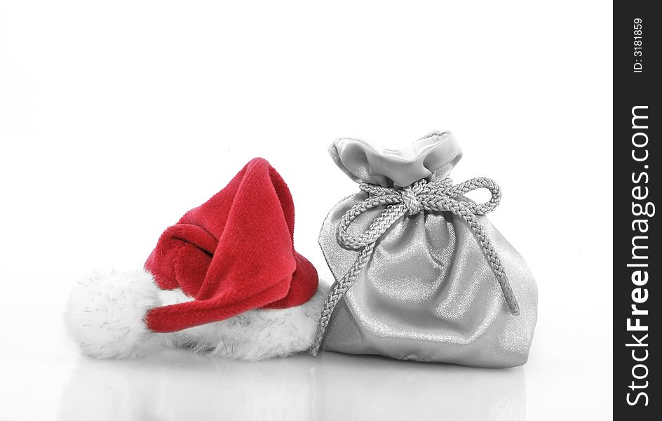 Silver gift bag with red santa claus hat. Silver gift bag with red santa claus hat