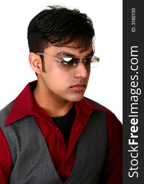 Portrait of young indian man with serious expression wearing fashion style dress