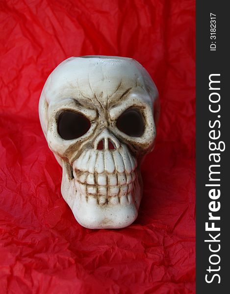 Ceramic skull front face with red backround. Ceramic skull front face with red backround