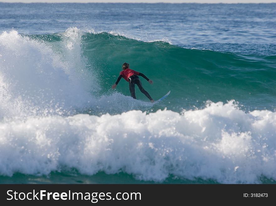 A surfer surfing the waves