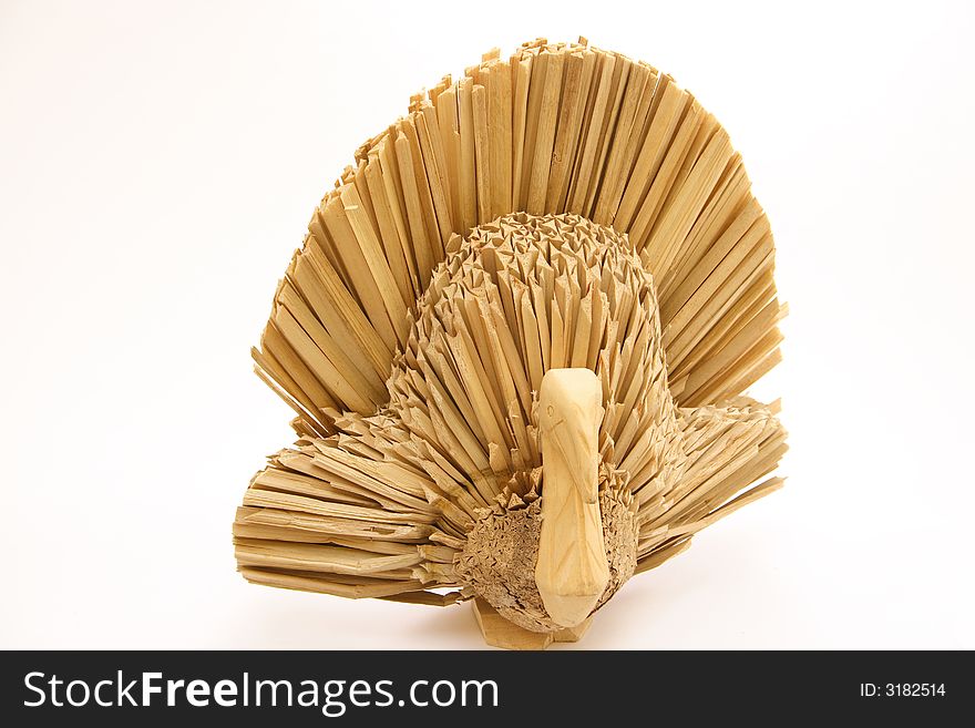 An isolated straw craft turkey on a white background. An isolated straw craft turkey on a white background.