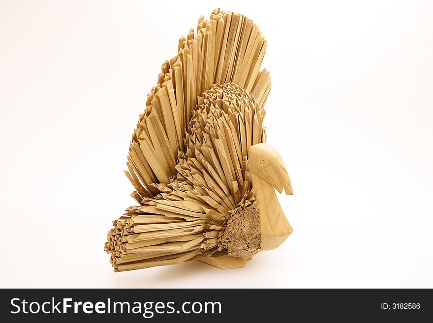 The side view of a craft, straw turkey isolated on a white background.