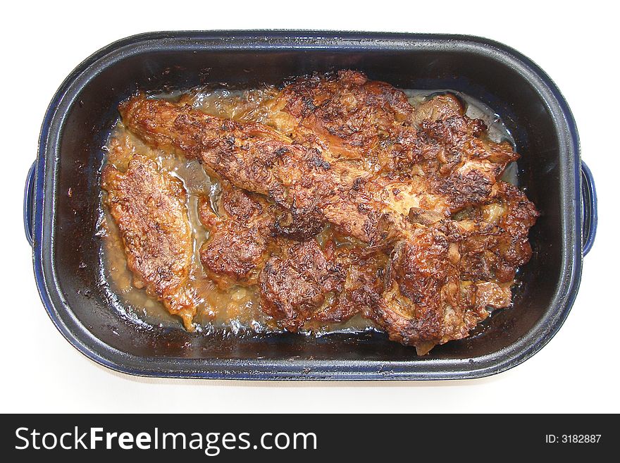 Fresh home-made pork meat in a pan. Fresh home-made pork meat in a pan.