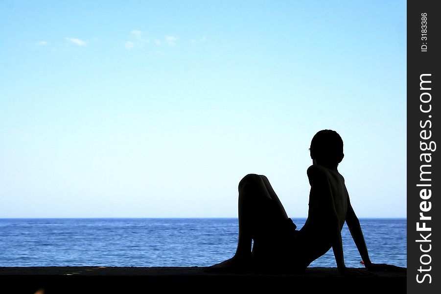 Silhouette Of Boy And Sea