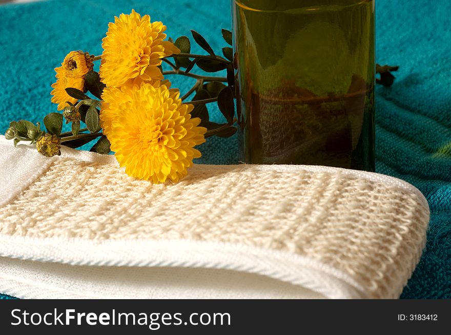 An image of sponge and flowers in bathroom. An image of sponge and flowers in bathroom