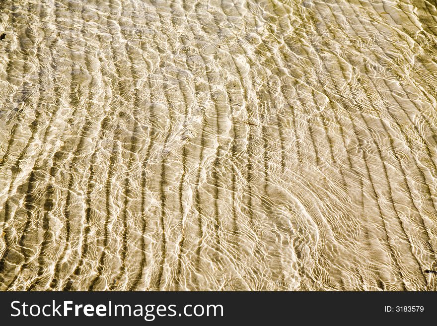 Sandy bottom of crystal clear lake - perfect background