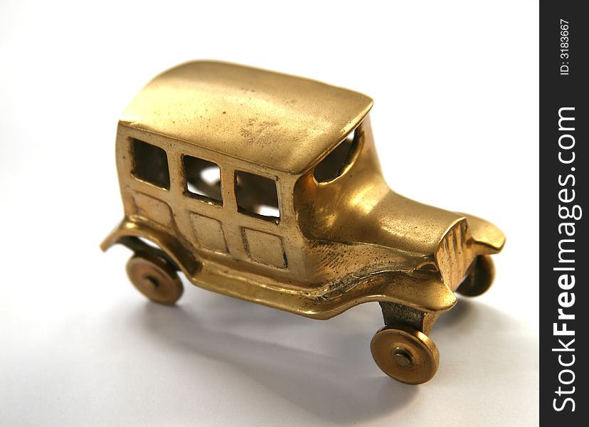 Vintage model of a brass car. Vintage model of a brass car