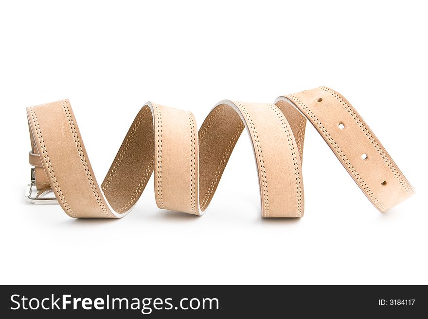 Beige leather belt with metal buckle on a white surface. Beige leather belt with metal buckle on a white surface