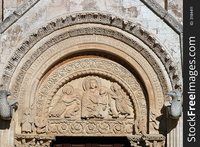 A romanic portal depicting our lady with baby christ, from a church in Monte Sant'Angelo, Italy